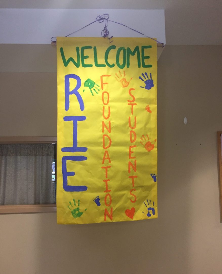 A bright colored paper banner welcoming students to RIE® Foundations™: Theory and Observation.